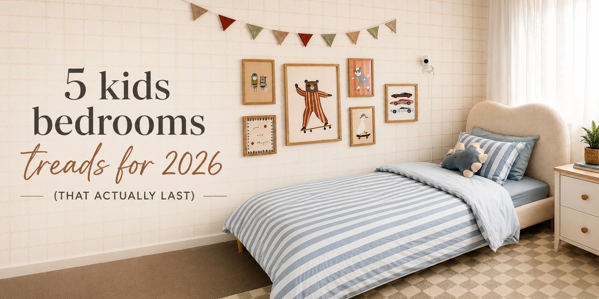 Boys’ bedroom with blue striped bedding and neutral check wallpaper, featuring text ‘5 kids bedroom trends for 2026 that actually last’